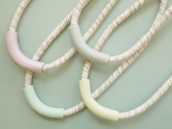 YYY short tube necklace on variegated cord YYY short tube necklace on variegated cord